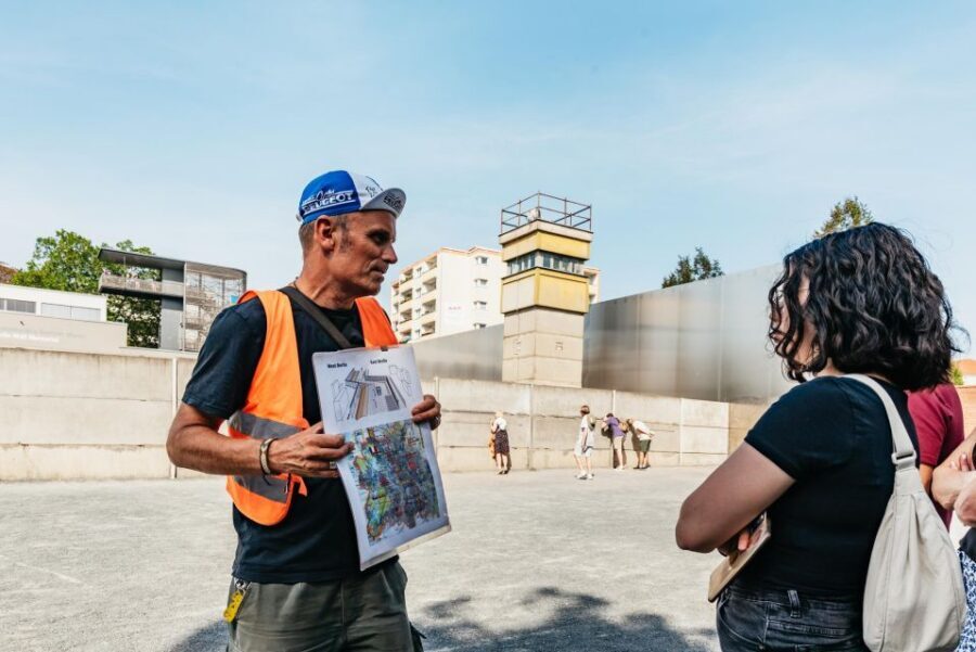 Berlin: Cold War Era History Guided Bike Tour - Checkpoint Charlie and Watchtower Views: Cold War Symbols Up Close