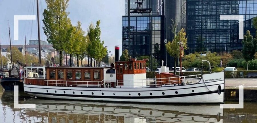 Berlin: Historic Boat Sightseeing City Center Tour - On-board comfort: saloon access, drinks, music, and audio quirks